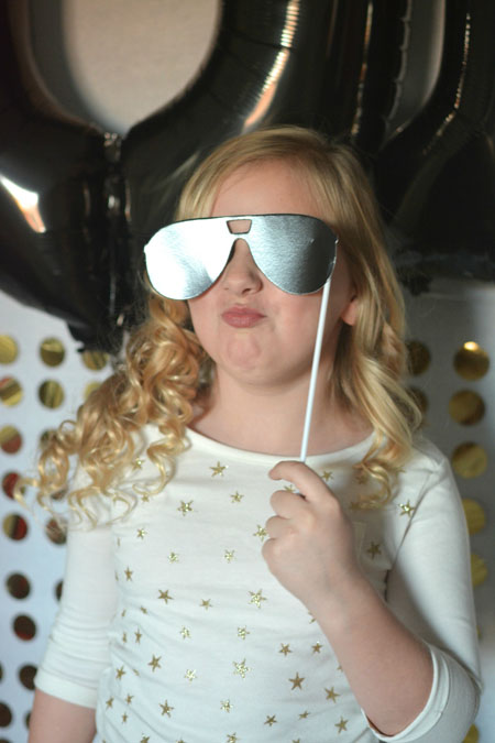 I love the gold and silver theme of my 2015 New Year's DIY Photo Booth DIY Sequin Photo Booth party fun