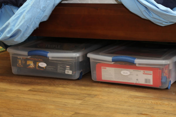 My favorite under the bed storage solutions are containers with wheels attached under the bed storage labeled containers