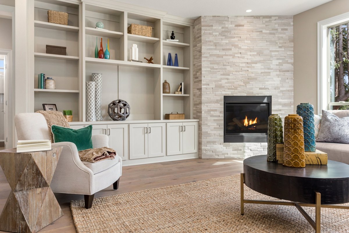 Stylish living room with textured décor, cozy accents, and a modern fireplace – enhancing apartment ambiance with minimal effort.