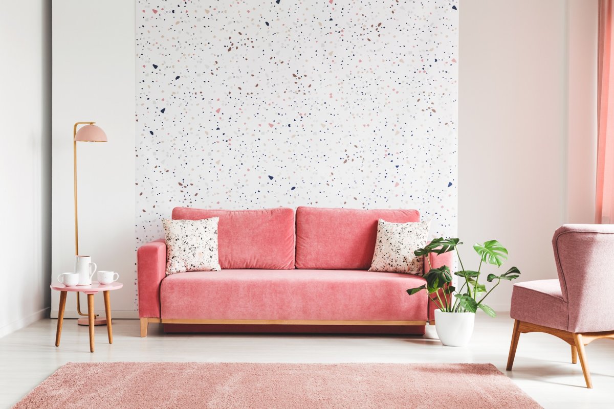 Cozy apartment room featuring removable wall art and soft pink furniture – perfect inspiration for renter-friendly home decoration.