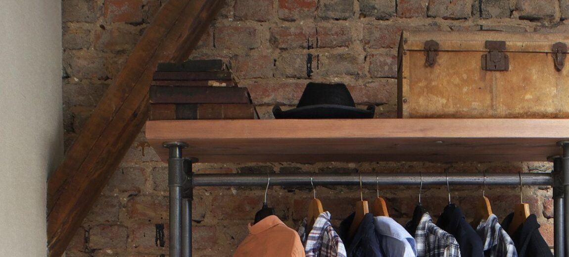 Suitcase on top shelf for storage.