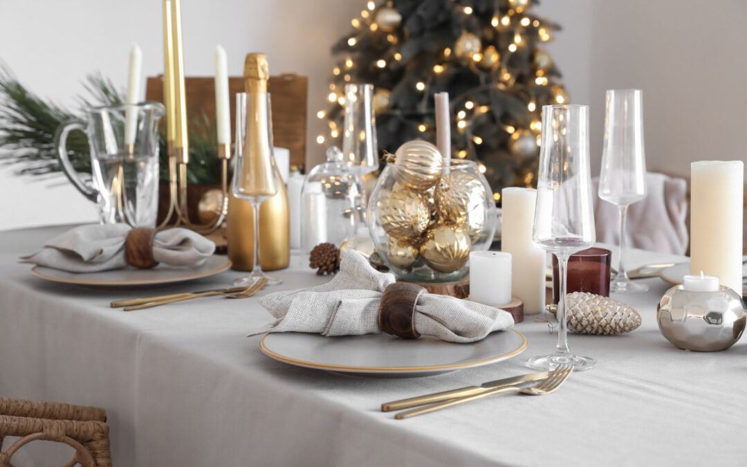 Gold holiday-themed accents on a dining table.