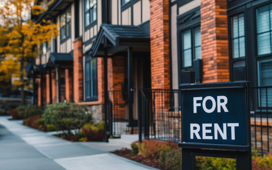 Townhome with 'For Rent' sign in front of it