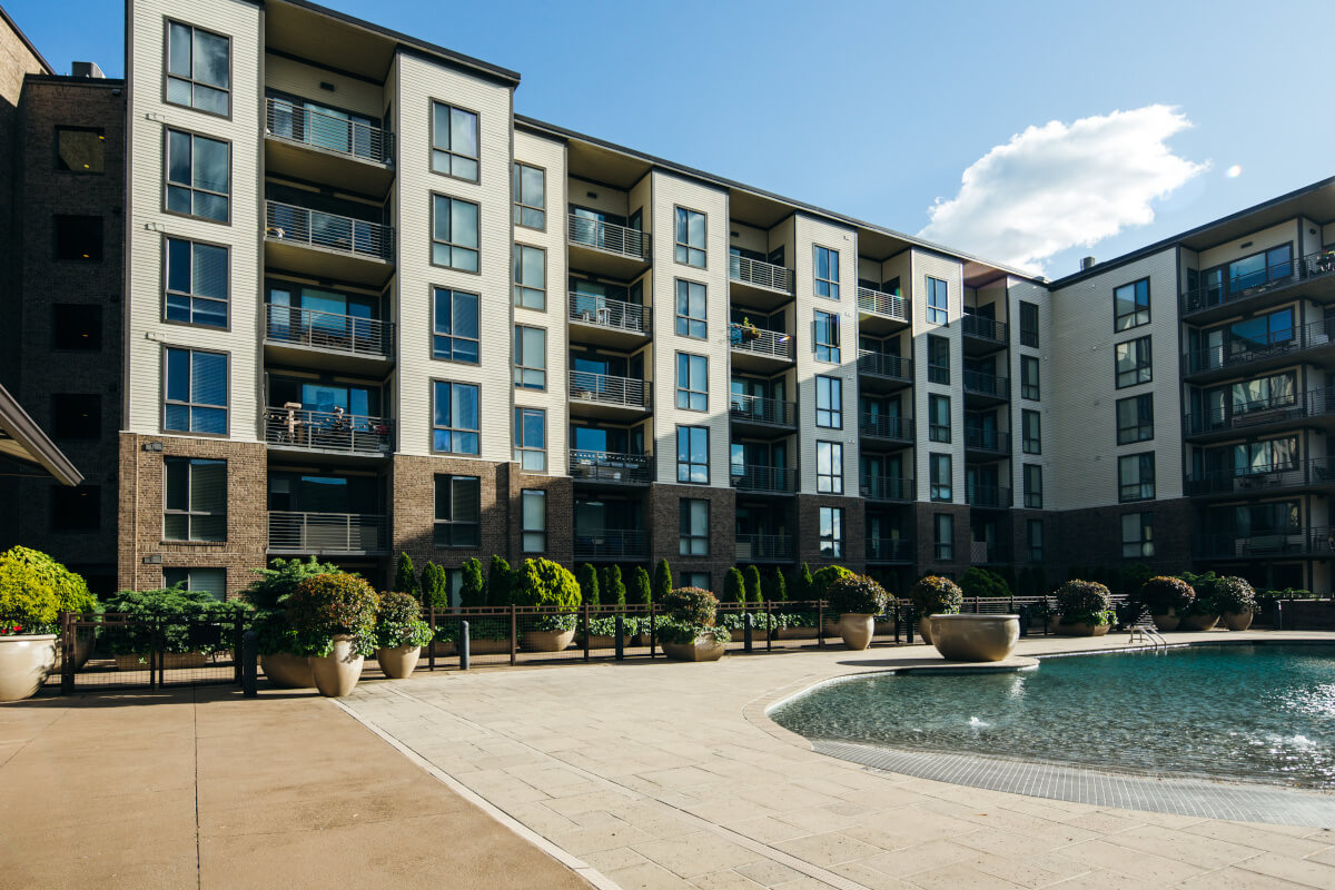 A view of a large apartment community from the community's pool area.