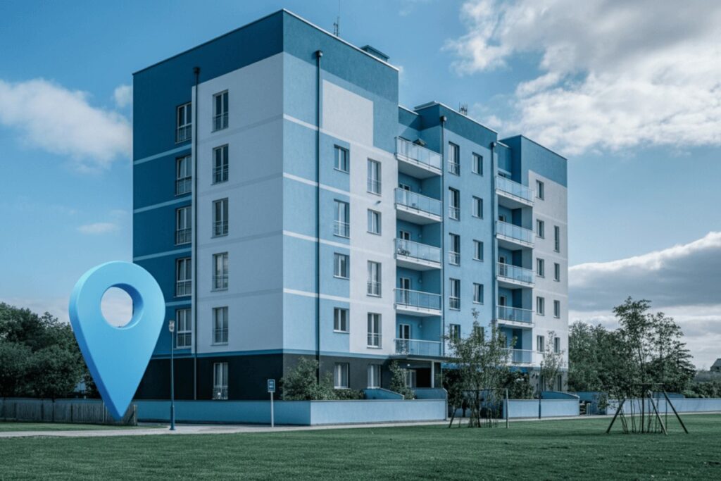 Apartment building with location pin in front of it
