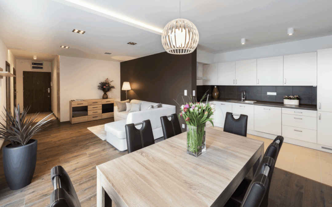 An apartment is furnished with wood and black accents.