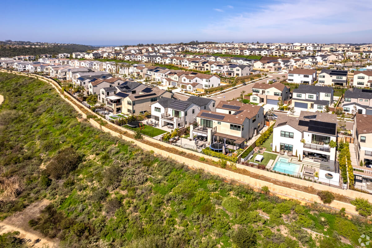 Suburban homes in Carmel Valley, San Diego, with landscaped yards and community planning.