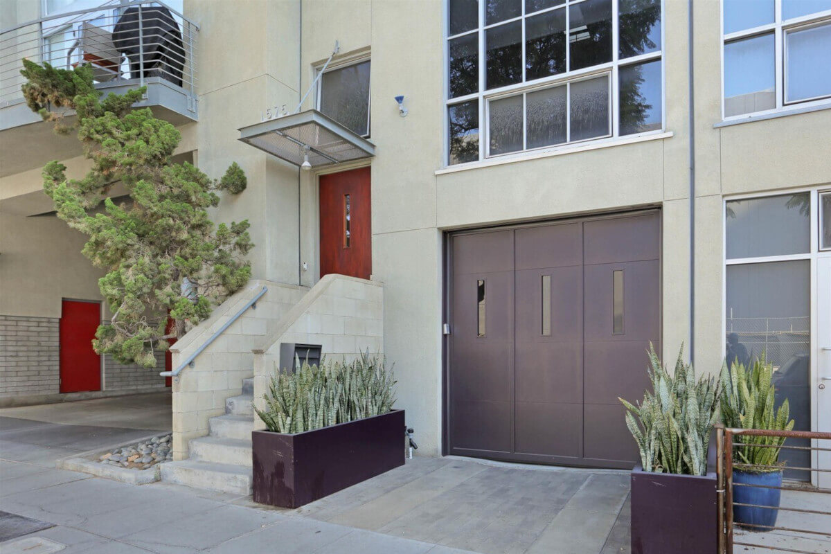 1575 Kettner Boulevard is a townhome in Downtown San Diego with a red front door.