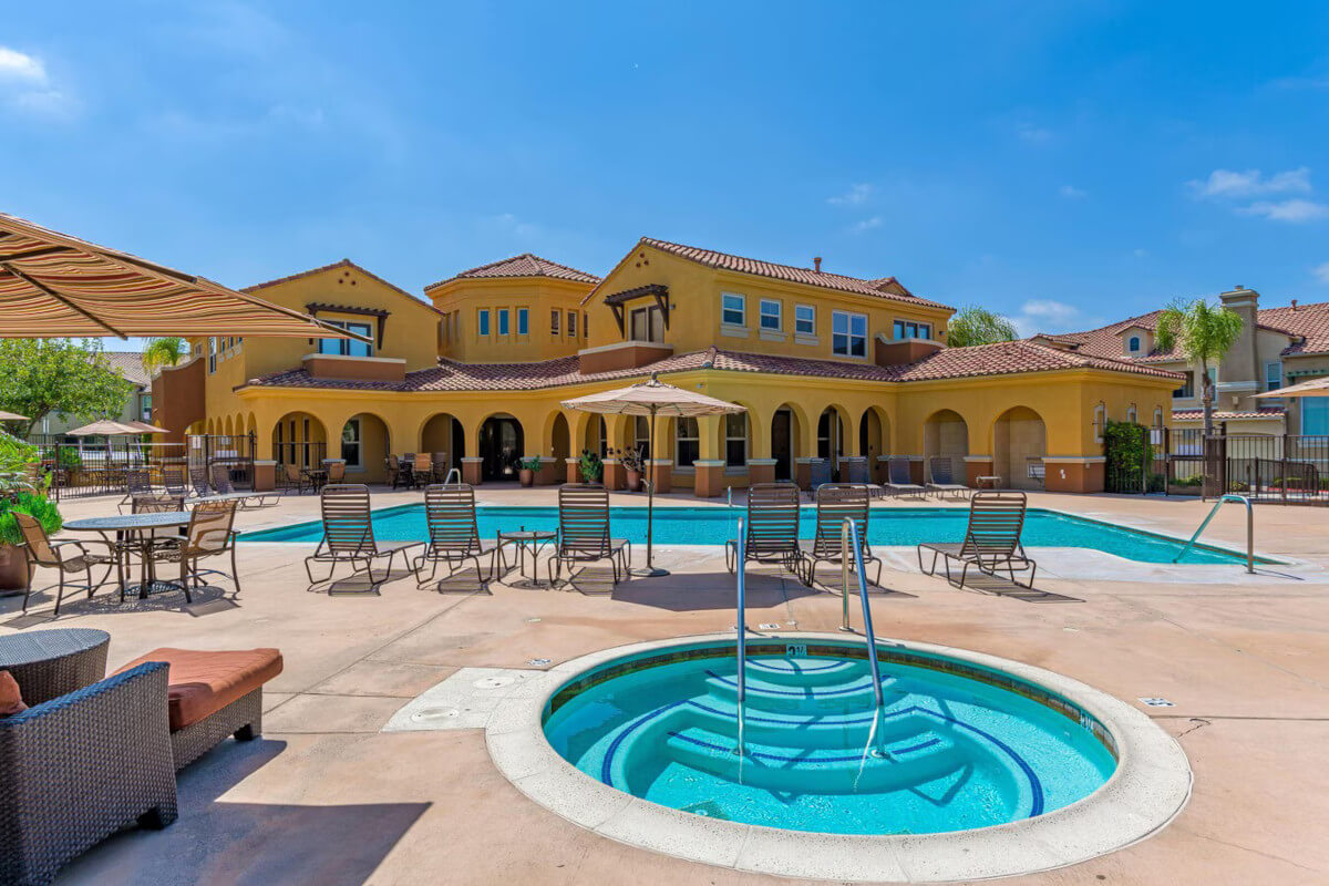 RiverEdge Terrace Townhomes is a townhome community in Ocean Crest with Spanish-style architecture.