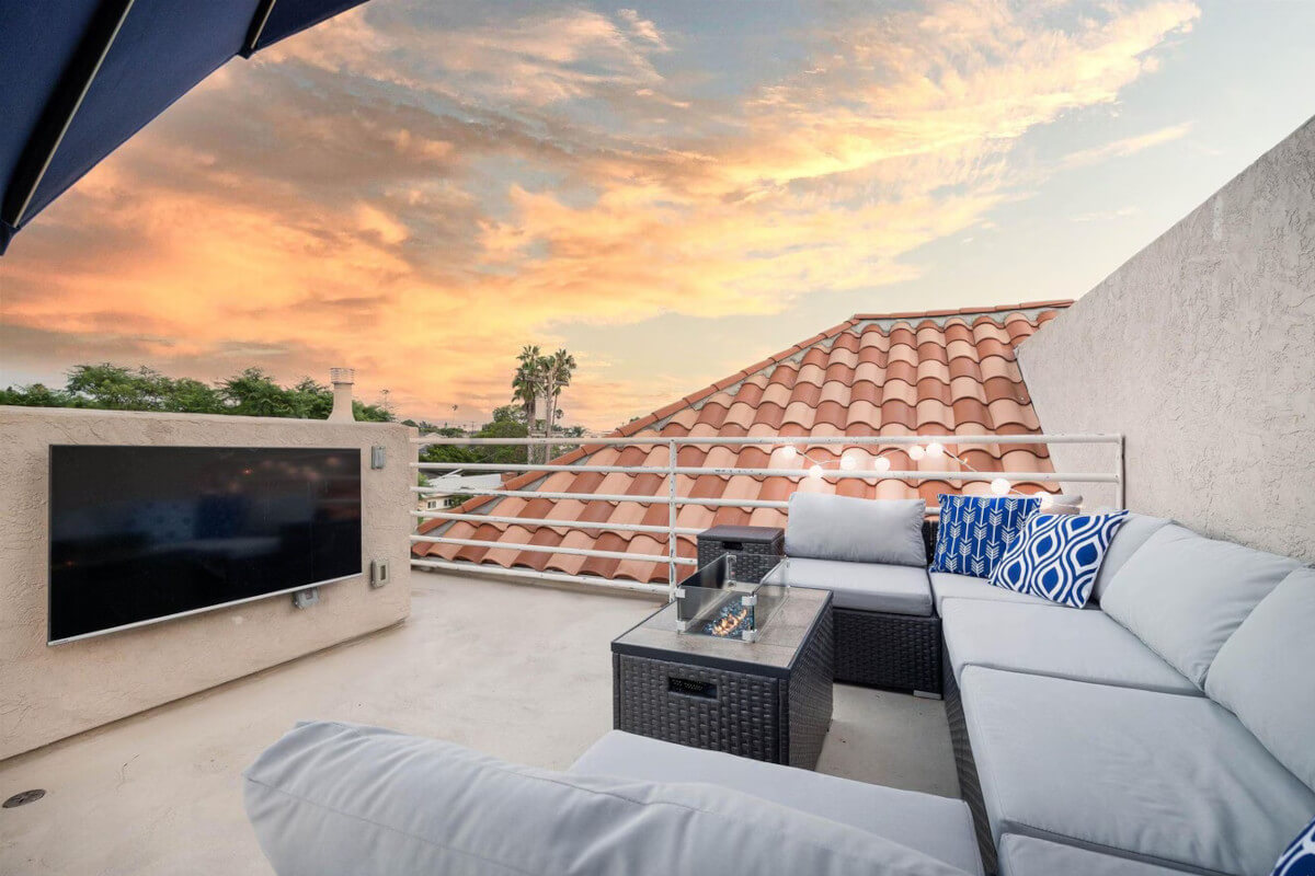 1079 Sapphire Street has a rooftop patio where residents can watch TV and enjoy the sunset.
