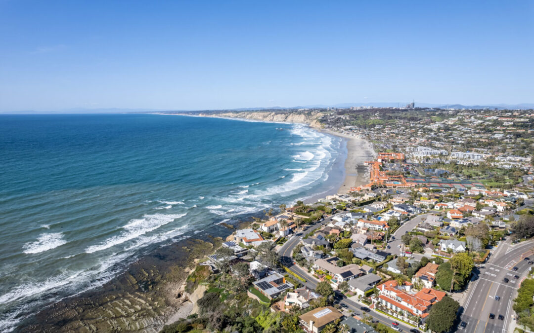 Aerial view of the safest neighborhoods along the San Diego coastline, featuring oceanfront homes and scenic bluffs.
