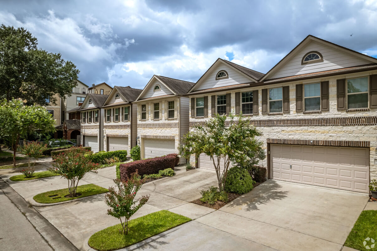Elegant, Craftsman-style townhomes on a tree-lined street