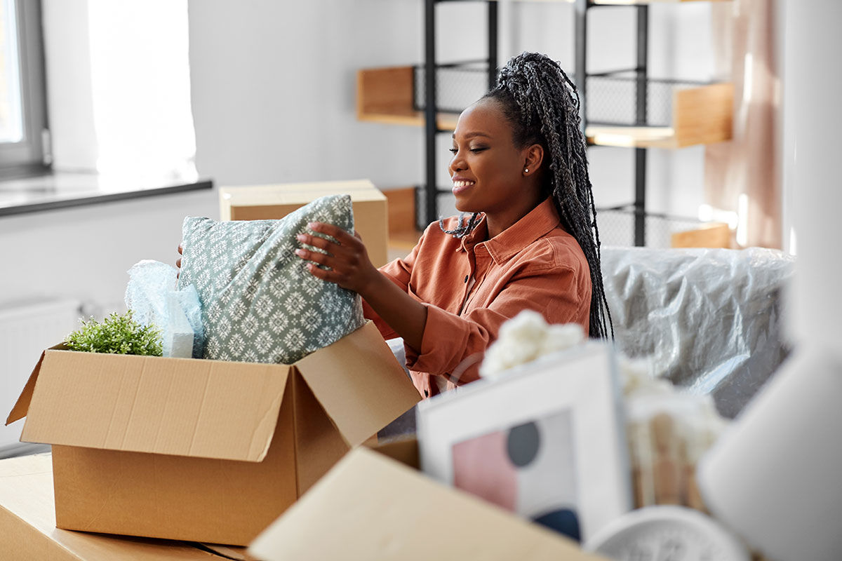 Renter unpacking boxes after moving. 
