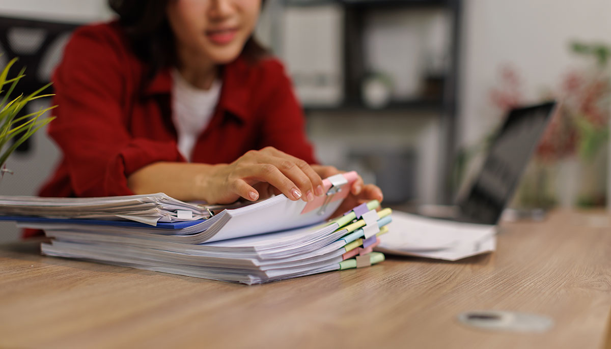 Renter getting their paperwork together before applying for an apartment.