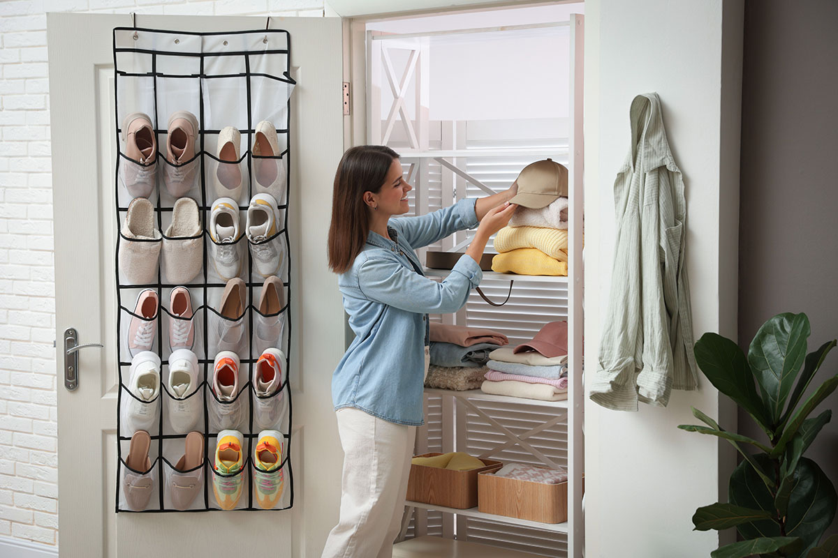 Renter using vertical closet storage to save closet space.